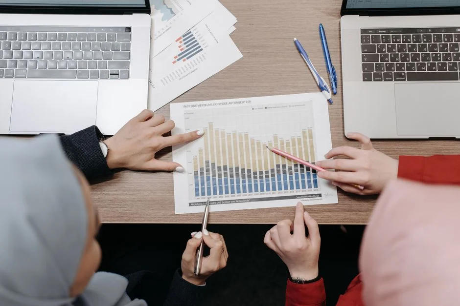 A top view on charts and smartphone in an office, showcasing data analytics.